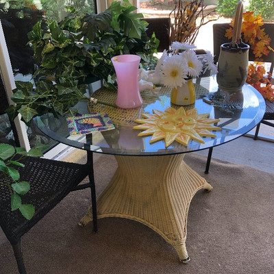 Vintage wicker-base table with glass top