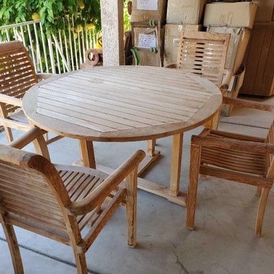 704: 	
Wooden Patio Table with 4 Chairs
Table measures approx 47