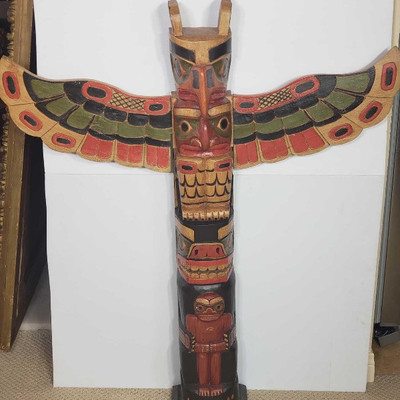 482: 	
Hand Carved Wooden Totem Pole
Measures Approximately 40