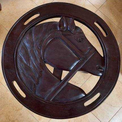 52:	
Two Red Mahogany Glass Top Tables
Fantastic red Mahogany wood side tables. Hand carved with profile of horse head on top. Measures...
