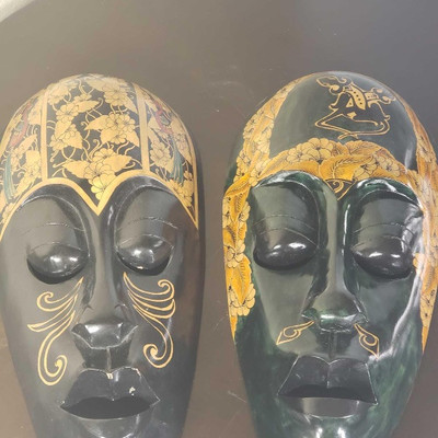 270:
Hand Carved Wooden Mask's
	
Special design, and hand painted. Lombok Island Mask. Hand carved from Mahogany. 2 of them measuring...