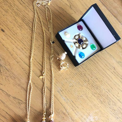 Collection of necklaces with egg shaped pendant and one more