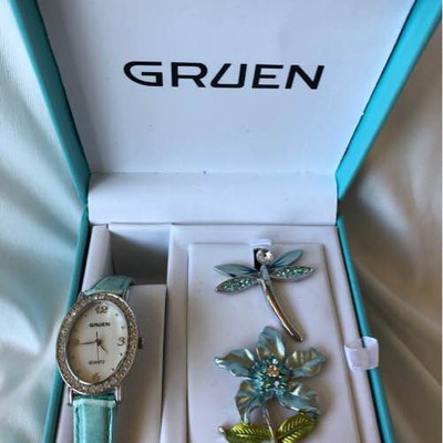 Gruen watch and matching pins