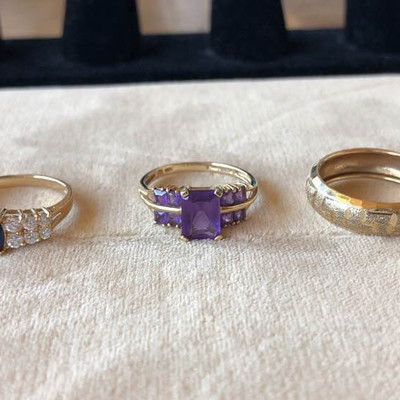 A trio of 14 karat gold rings