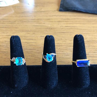 Gold rings, blue stones