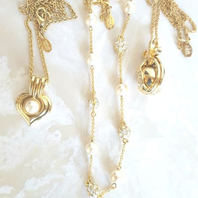 Joan Rivers and Nolan Miller pendants