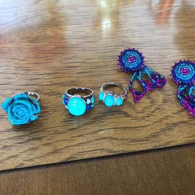 A trio of turquoise rings on bands marked 925
