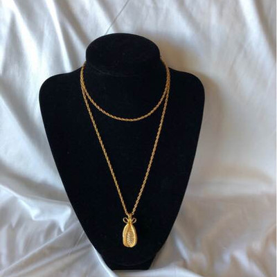 Joan Rivers rhinestone Faberge egg and a 28 inch rope chain