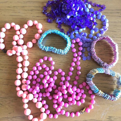 A collection of pastel beads and shells