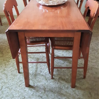 Lovely long drop leaf dining table - has 6 matching chairs