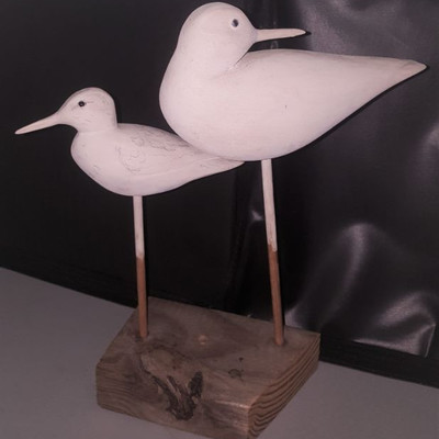 Handcarved pair of shorebirds on driftwood