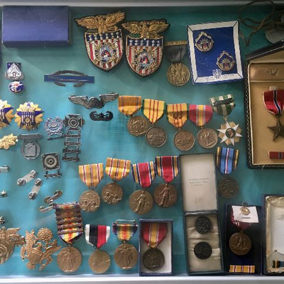 Military medals, Lt Bars, Items with different insignias. 