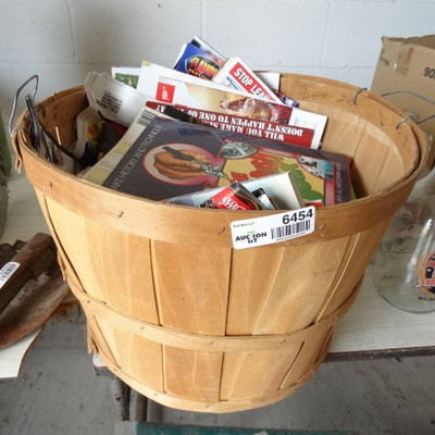 Apple basket with magazines.