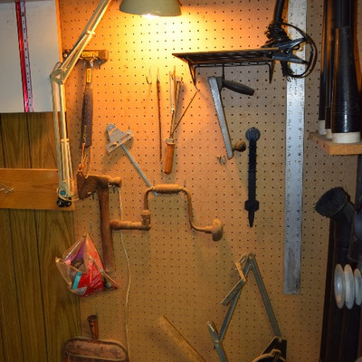 Hammer, Ax, Metal Ruler, and Mounted Lamp
