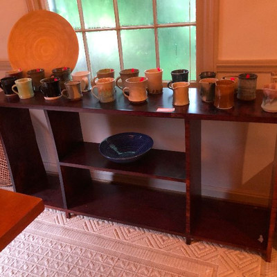 Look at all this lovely original pottery and earthenware. That parlor table is also handmade from the 60s