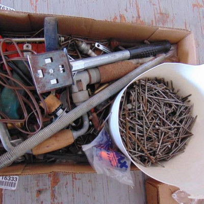 Bucket of nails, scrapper, and more