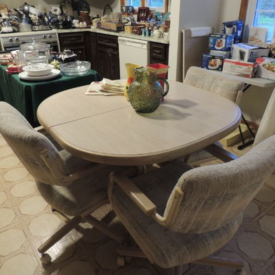 kitchen table with one leaf, three swivel chairs