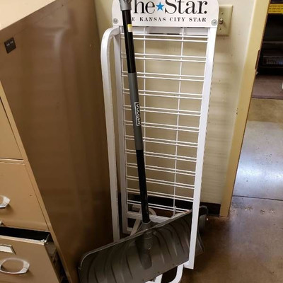 snow shovel and newspaper rack