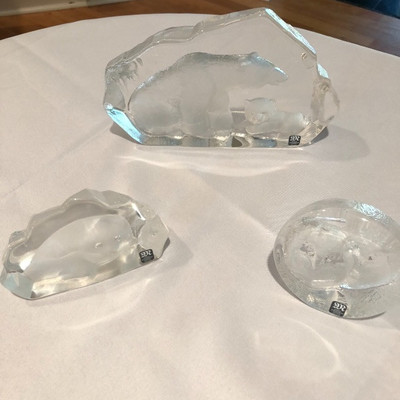 several Mats Jonasson crystal sculptures