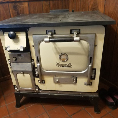 Black and Cream Monarch Wood Burning stove. $750 or best offer. Works great!