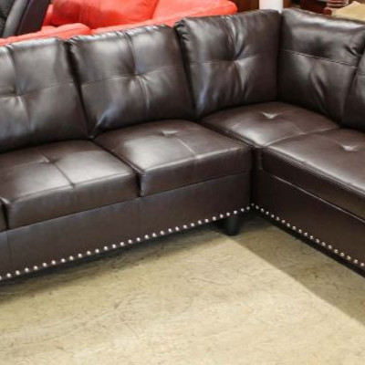  NEW 2 Piece Button Tufted Leather Sectional in the Brown

Auction Estimate $300-$600 â€“ Located Inside 