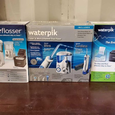 2001: 2001: Three Waterpik Water Flossers	
Each come with a unit for home as well as a portable travel sized unit.