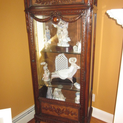 Ornate Carved Lighted Curio Cabinets  