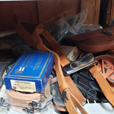 911: 	
Various Leather Belts, Holsters, Sheaths, and a Bag
Various Leather Belts, Holsters, Sheaths, and a Bag
