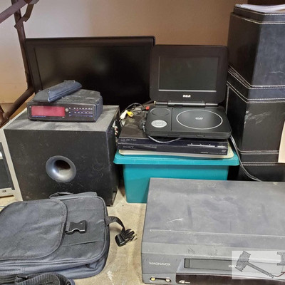 415: 	
Sony DVD Player, RCA Portable DVD Player, iPod Speaker Dock, Speakers, Assorted DVDs and More
Numerous items in this lot: Magnavox...