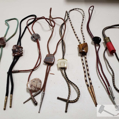 922: 	
8 Bolo Ties with Stones
Pretty awesome Bolo ties with stones! This is a nice variety of decorative dress ties, well kept and ready...