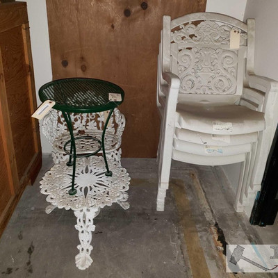 3515: 	
Decorative Yard Table and Chair & More!
Decorative Yard Table and Chair. Outdoor Metal End Table and 4 Plastic Lawn Chairs