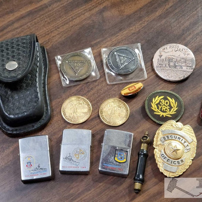 2305: 	
Military Zippo Lighters, Handcuffs, La Societe des Quarante Hommes Coins and More
Military Zippo Lighters, Handcuffs, La Societe...