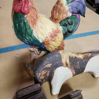 2138:	
Farm animal staues and cow bells
A colorful ceramic kitchen rooster, a carved wooden bull, and two metal cow bells.   Measures...