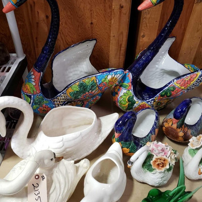 2135: Glass geese dishes, flower vases and candle holders
This lot has a varied collection of porcelain geese, most are painted and...