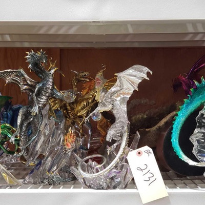 2131: 	
Decorative Dragon's
A large collection of dragon figurines made of various materials; metal, blown glass, pewter, brass and gold...