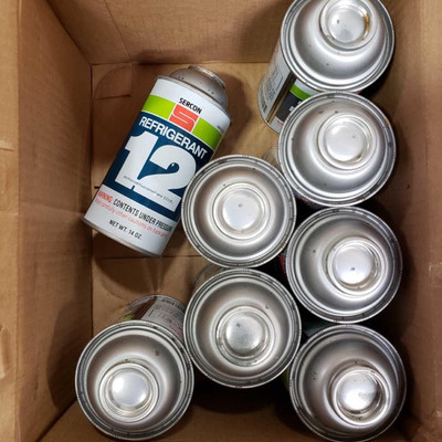 1224: 	
8 cans of R12
Eight new cans of Sercon R12 chemical refrigerant, part no. 06012