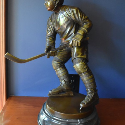 Bronze hockey player sculpture by Jim Davidson