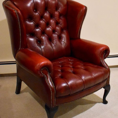 Matching red leather wing back chair