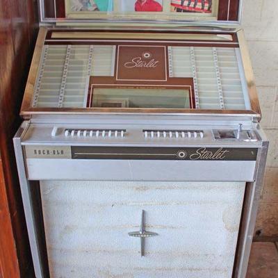  VINTAGE Rock-Ola Jukebox with some 45 RPM Records

Auction Estimate $100-$500 â€“ Located Dock


