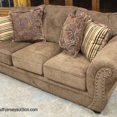  NEW Tan Upholstered Sofa with Decorative Pillows

Auction Estimate $300-$600 â€“ Located Inside 