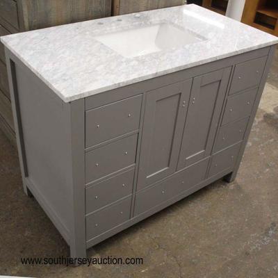  NEW Marble Top 9 Drawer 2 Door Bathroom Vanity with Square Sink and Hardware Located in the Drawers

Located Inside â€“ Auction Estimate...