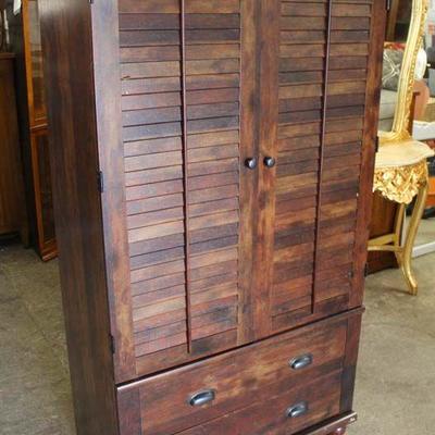  NEW Louver Door Armoire in the Mahogany Finish

Located Inside â€“ Auction Estimate $100-$300

  