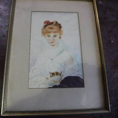 Woman with a cat framed art work