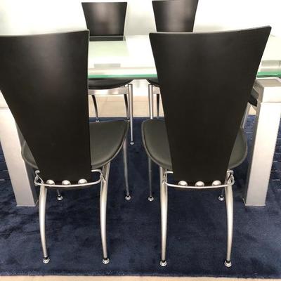 - Nickel w/Glass top Draw-leaf Dining Table w/6 Black Chairs - $575
	(67W  39-1/2L  29-1/2H and two 14