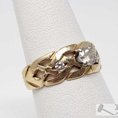 820: 	
14k Gold Ring with Center Diamond and Accent Diamonds, 3.8g
Weighs approx 3.8g, approx .5ct, size 7 
OS19-017630.79