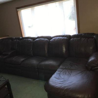Dark brown 12..5 Foot multiple piece sectional .
Arrange it how you want, double recliner, table & chaise lounge