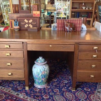Love the brass pulls and feet on this executive style desk!