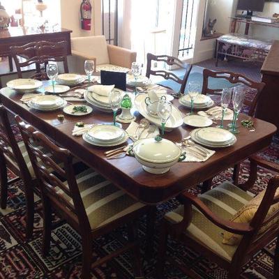 Sheraton style dining set w/6 chairs, 2 leaves, heavy brass claw feet, like new silk striped upholstery on seats.
