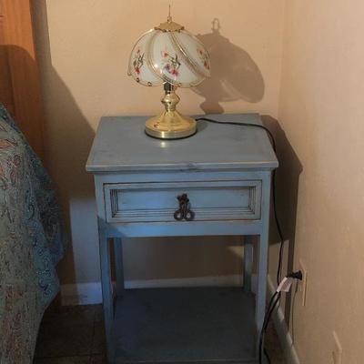 One of two blue nightstands