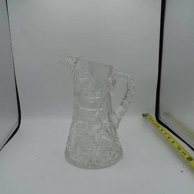 Clear glass water pitcher.